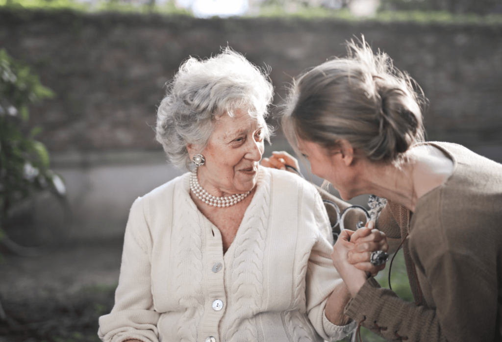Elder care tips senior woman happily meeting a friend