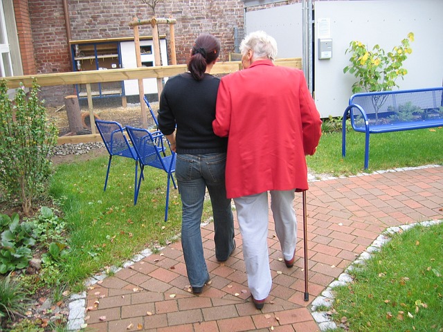 Elderly and youth on a walk